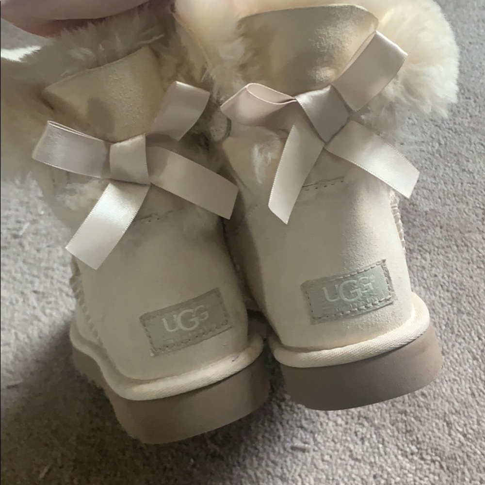 Cream uggs with bow back